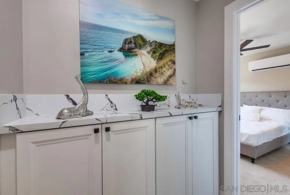 9136 Northcote Road Santee, CA 92071 - Photo 16 of 33 a bathroom with a granite countertop sink and a mirror
