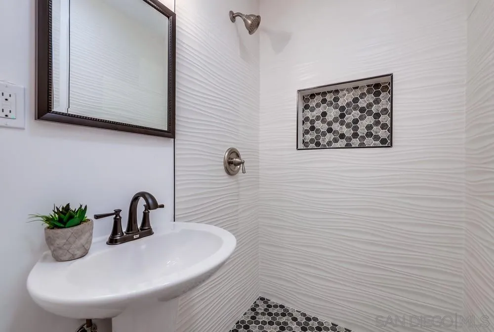 9136 Northcote Road Santee, CA 92071 - Photo 18 of 33 a bathroom with a sink and a mirror