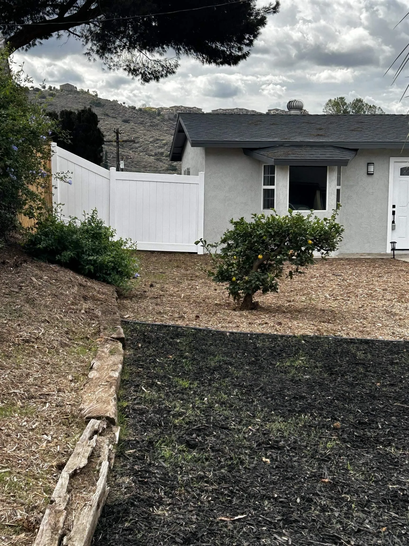 9136 Northcote Road Santee, CA 92071 - Photo 24 of 33 a view of a house with a yard