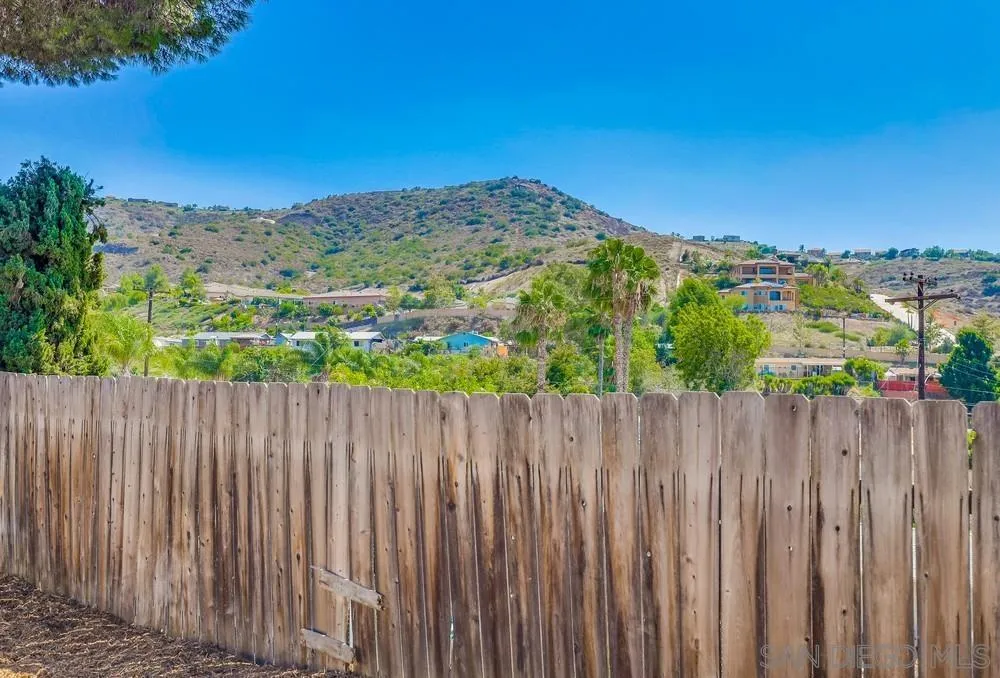 9136 Northcote Road Santee, CA 92071 - Photo 26 of 33 a view of a yard with wooden fence