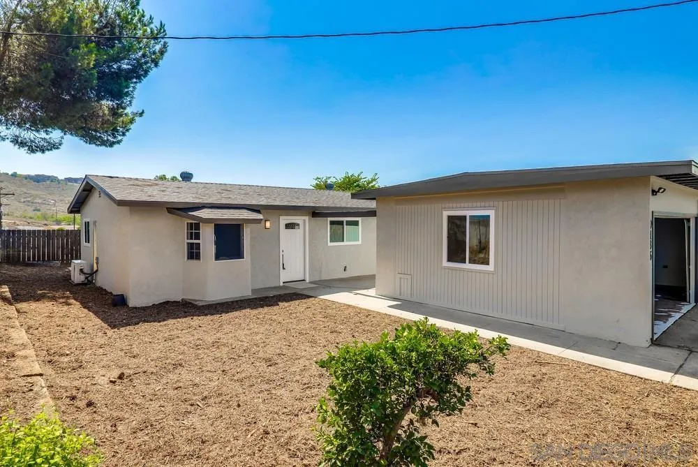 9136 Northcote Road Santee, CA 92071 - Photo 27 of 33 a view of a house with a backyard