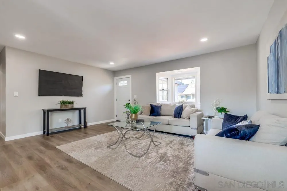 9136 Northcote Road Santee, CA 92071 - Photo 9 of 33 a living room with furniture and a flat screen tv