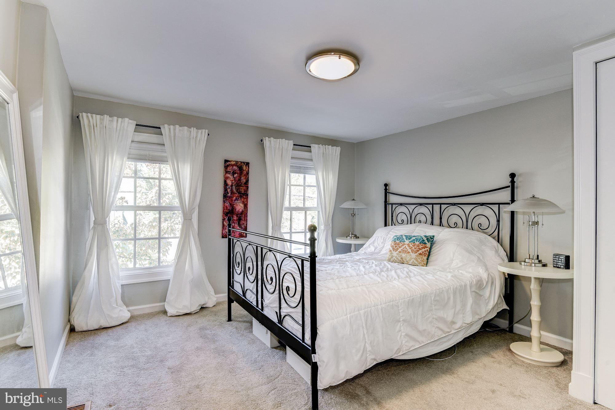 908 Pendleton Street Alexandria, VA 22314 - Photo 13 of 22 a bedroom with a bed and window