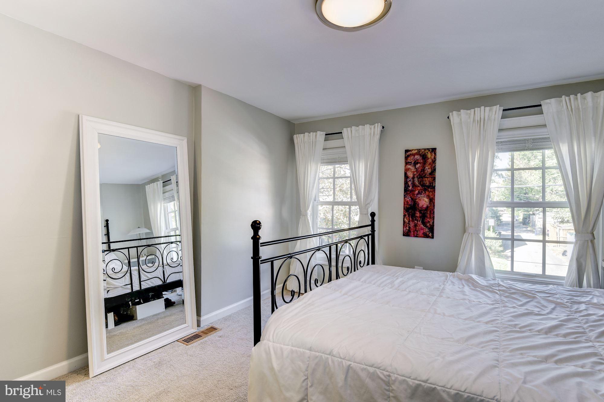 908 Pendleton Street Alexandria, VA 22314 - Photo 14 of 22 a bedroom with a bed and a window