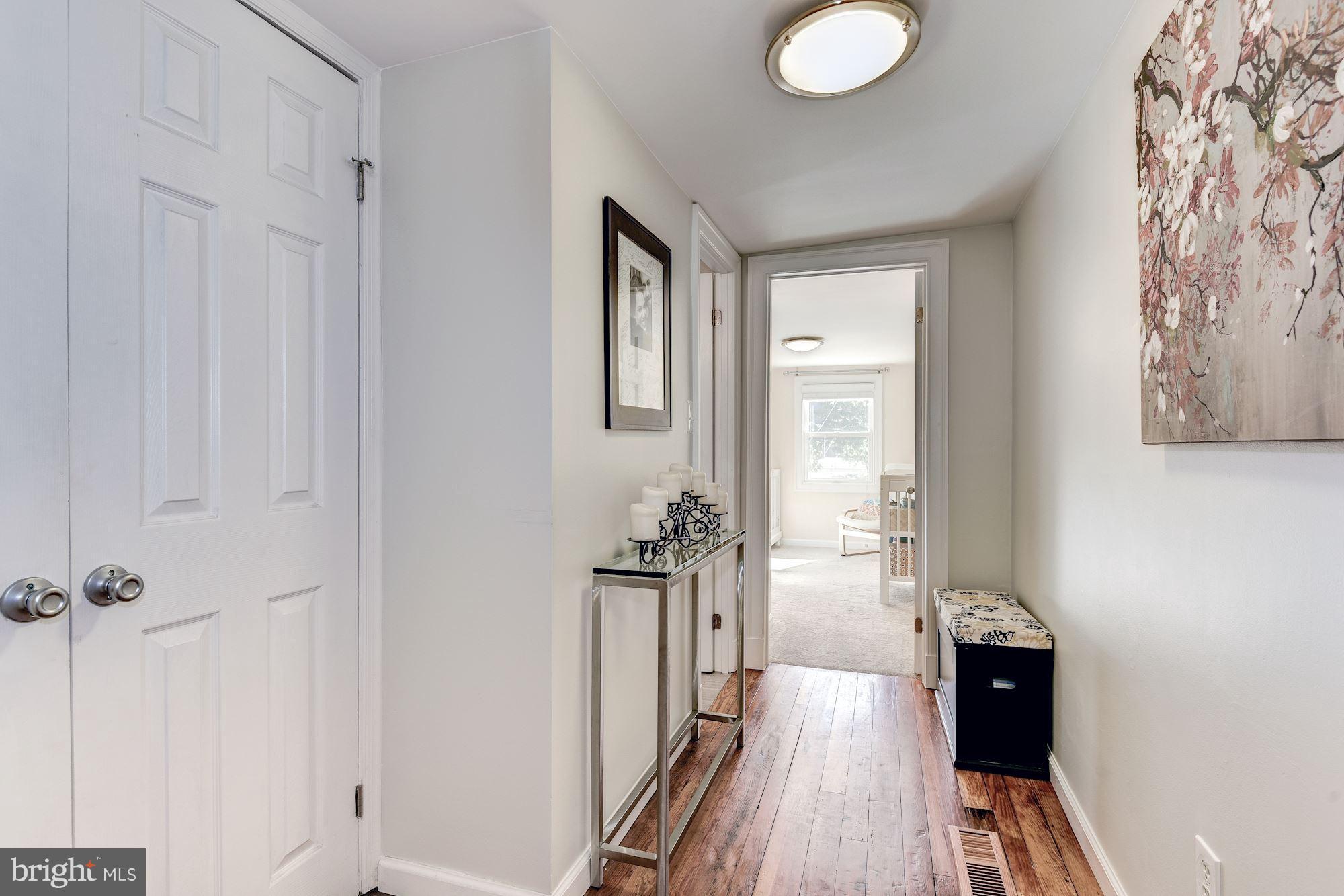 908 Pendleton Street Alexandria, VA 22314 - Photo 15 of 22 a view of a hallway view with wooden floor and staircase