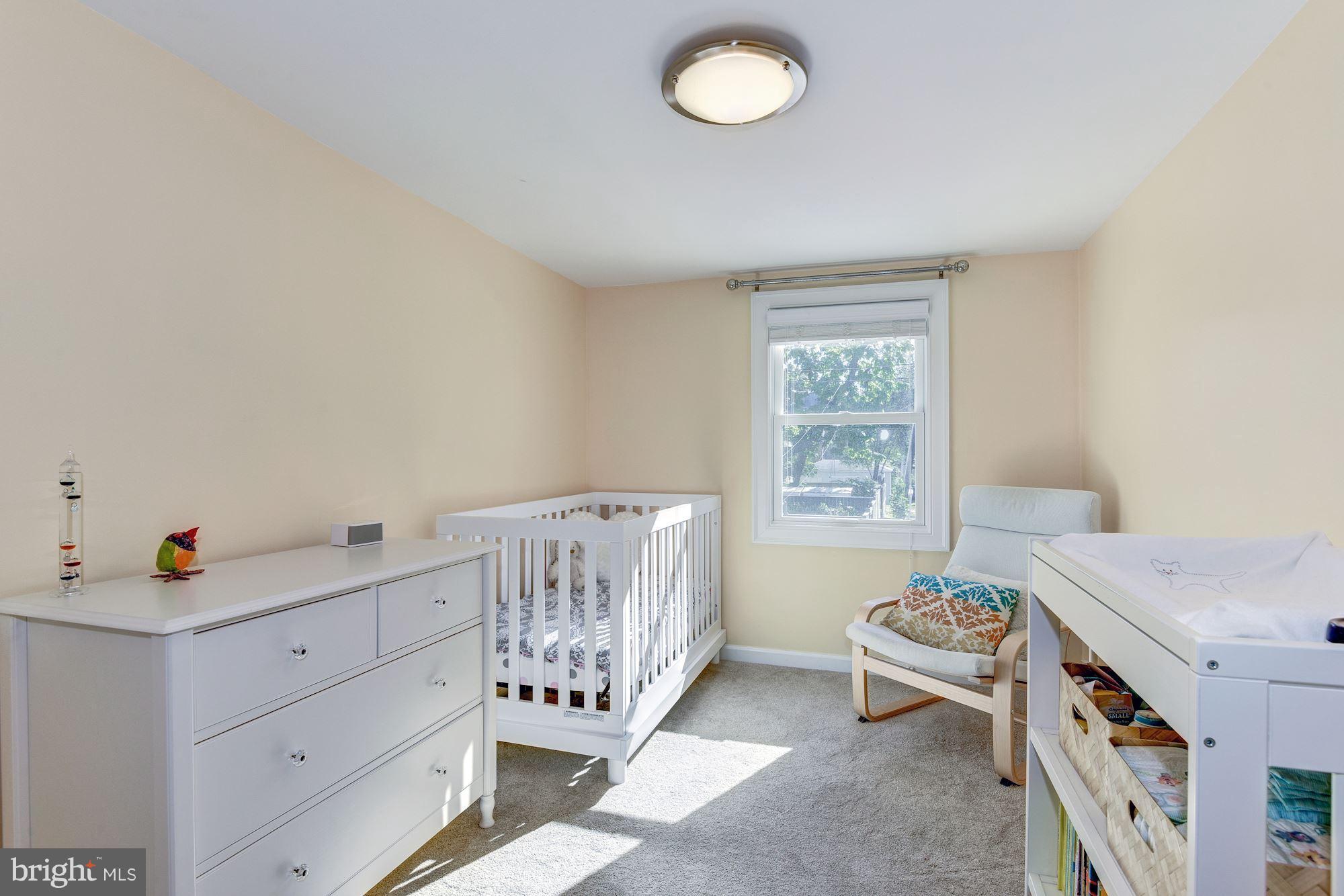 908 Pendleton Street Alexandria, VA 22314 - Photo 16 of 22 a bed room with a bed and a window