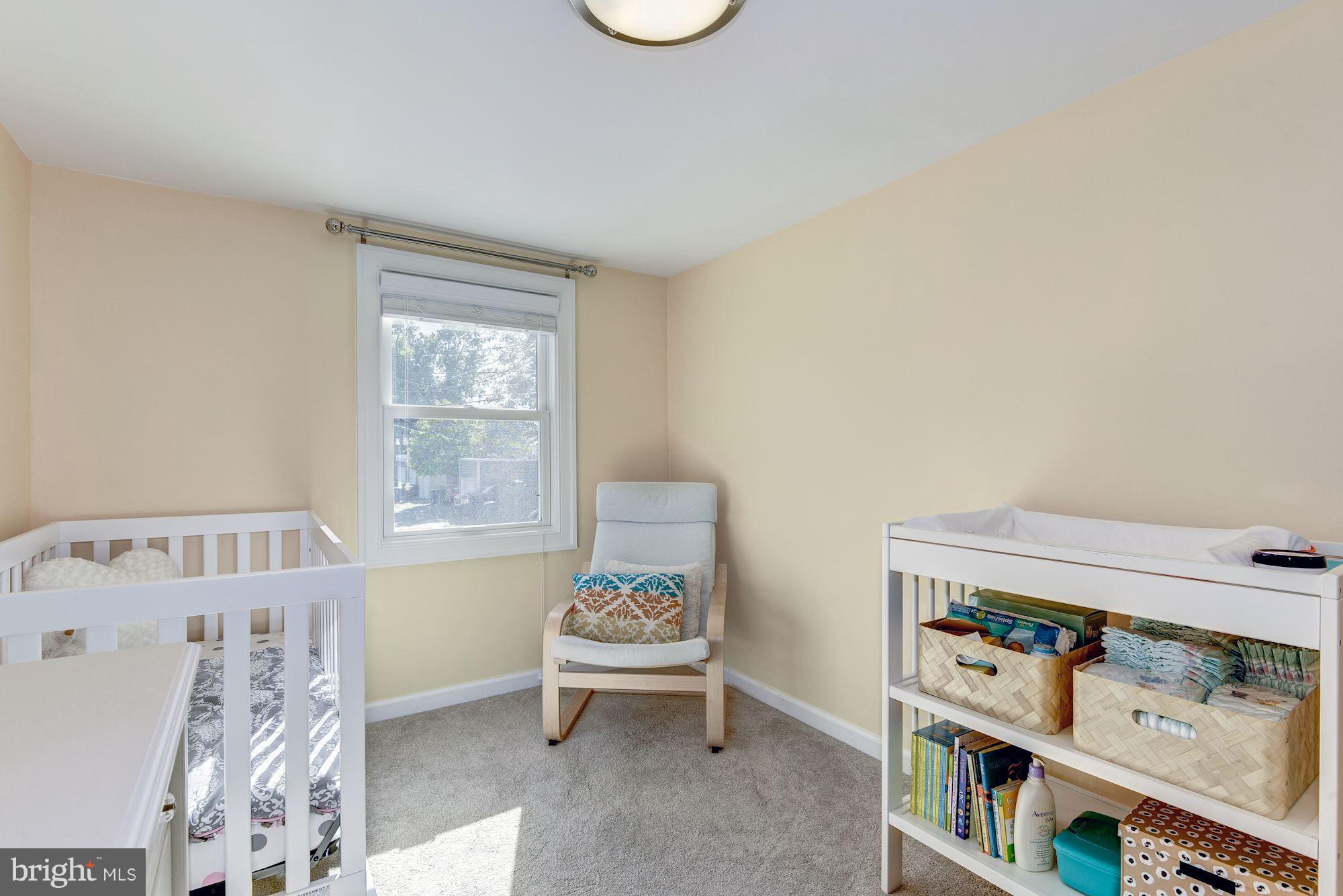 908 Pendleton Street Alexandria, VA 22314 - Photo 17 of 22 a bedroom with furniture and a window