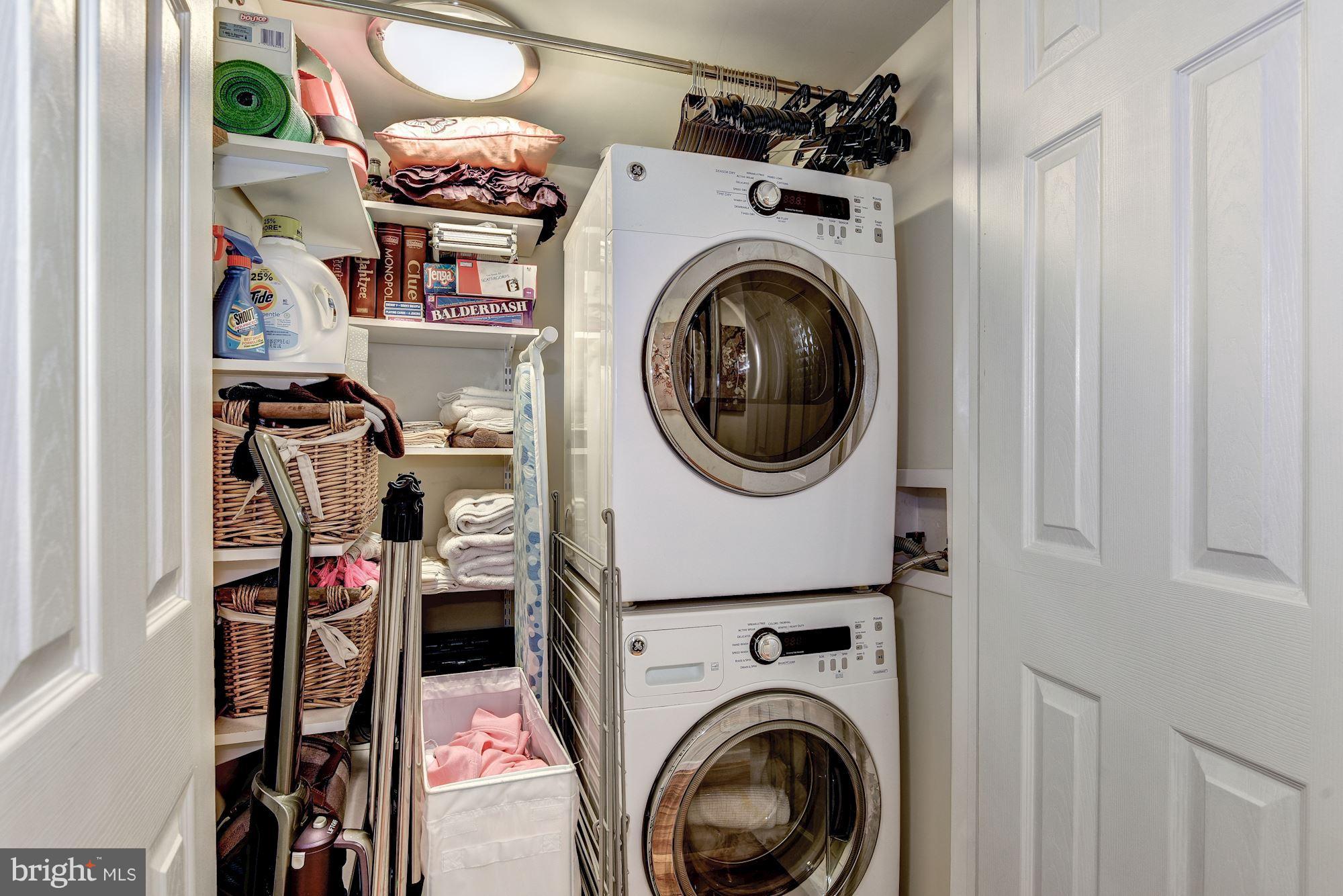 908 Pendleton Street Alexandria, VA 22314 - Photo 19 of 22 a utility room with dryer washer and a view of bedroom
