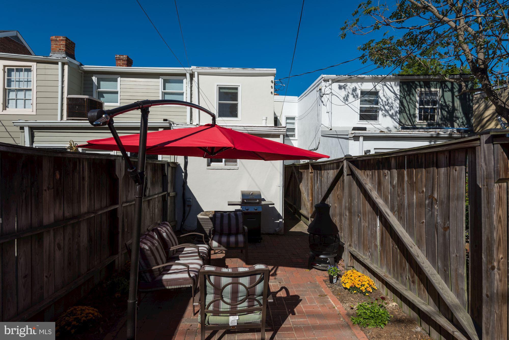908 Pendleton Street Alexandria, VA 22314 - Photo 21 of 22 a view of a balcony with two chairs and a barbeque