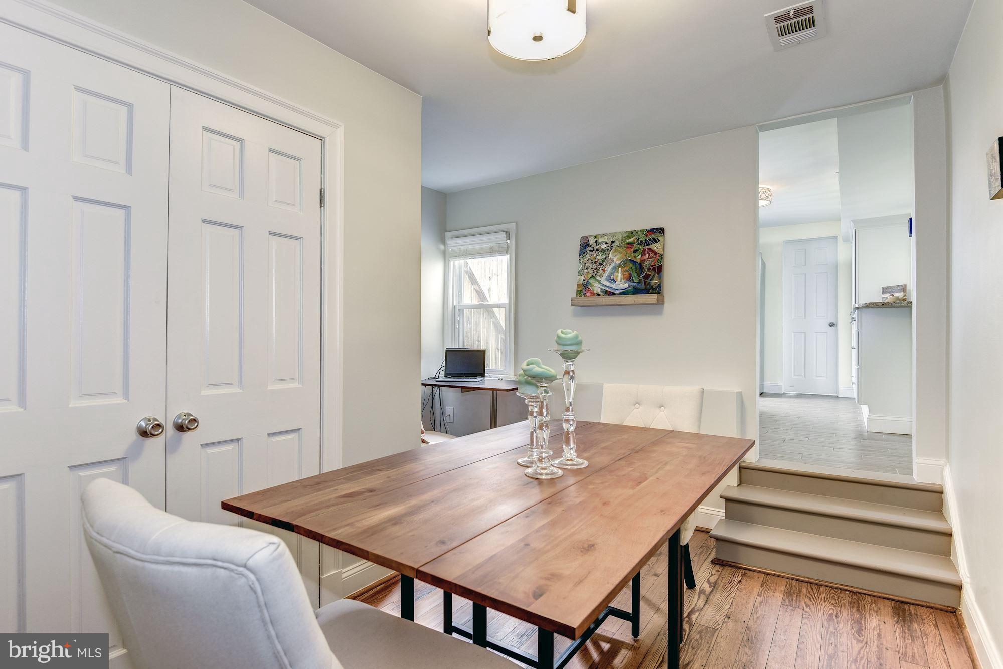 908 Pendleton Street Alexandria, VA 22314 - Photo 5 of 22 a view of a dining room with furniture and wooden floor