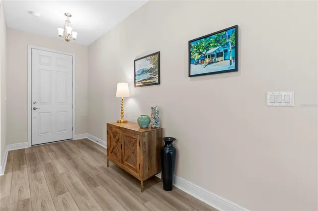 a kitchen with stainless steel appliances a sink a stove top oven a refrigerator a counter top space and cabinets