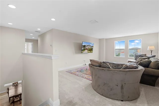 a en suite bathroom with a tub double sink and mirror