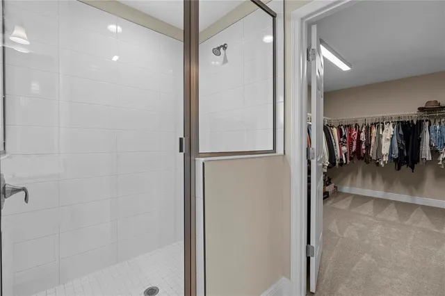 a view of a house with a big yard and potted plants