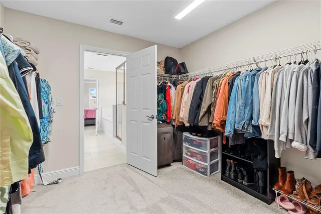 a view of a chairs and table in patio next to a yard