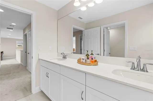 a picture of a bathroom with mirror and glass door