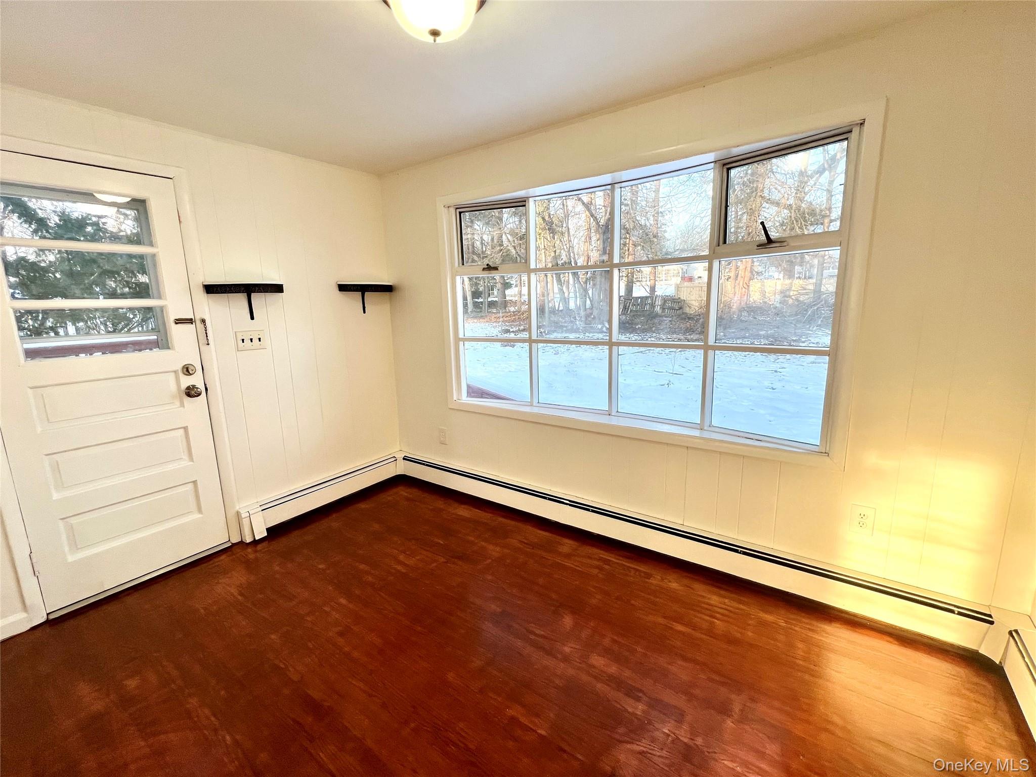 23 Independence Avenue Middletown, NY 10940 - Photo 11 of 35 an empty room with wooden floor and windows