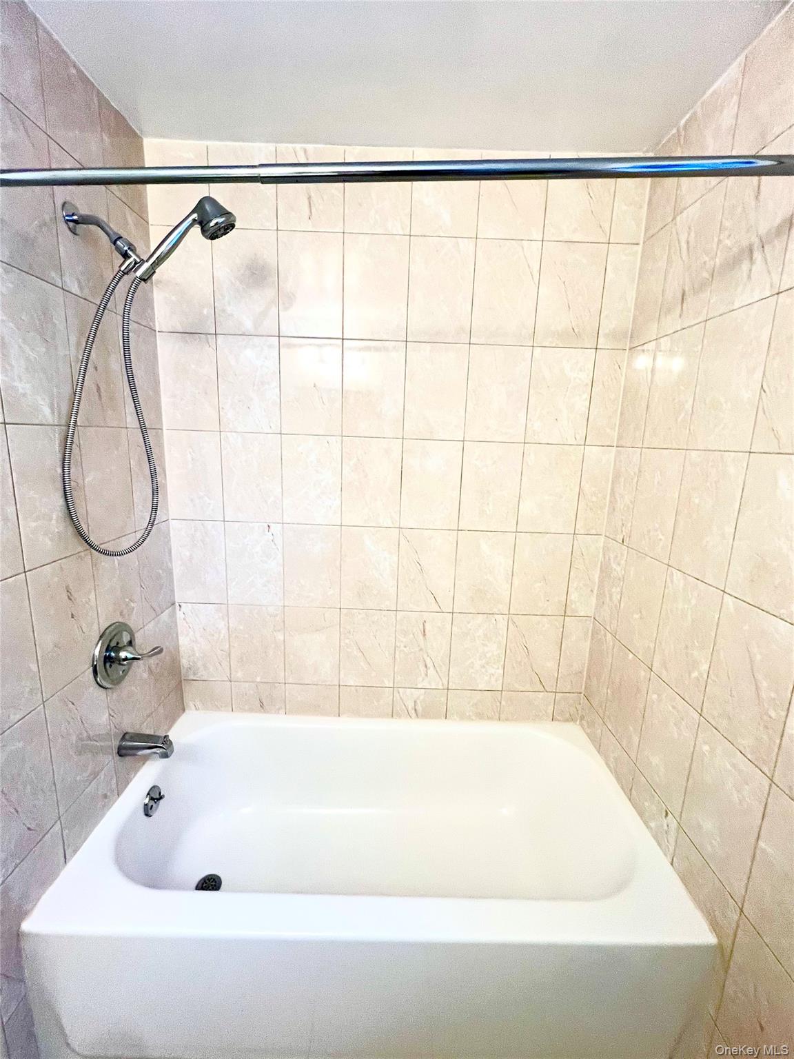 23 Independence Avenue Middletown, NY 10940 - Photo 15 of 35 a bathroom with a bath tub and a window