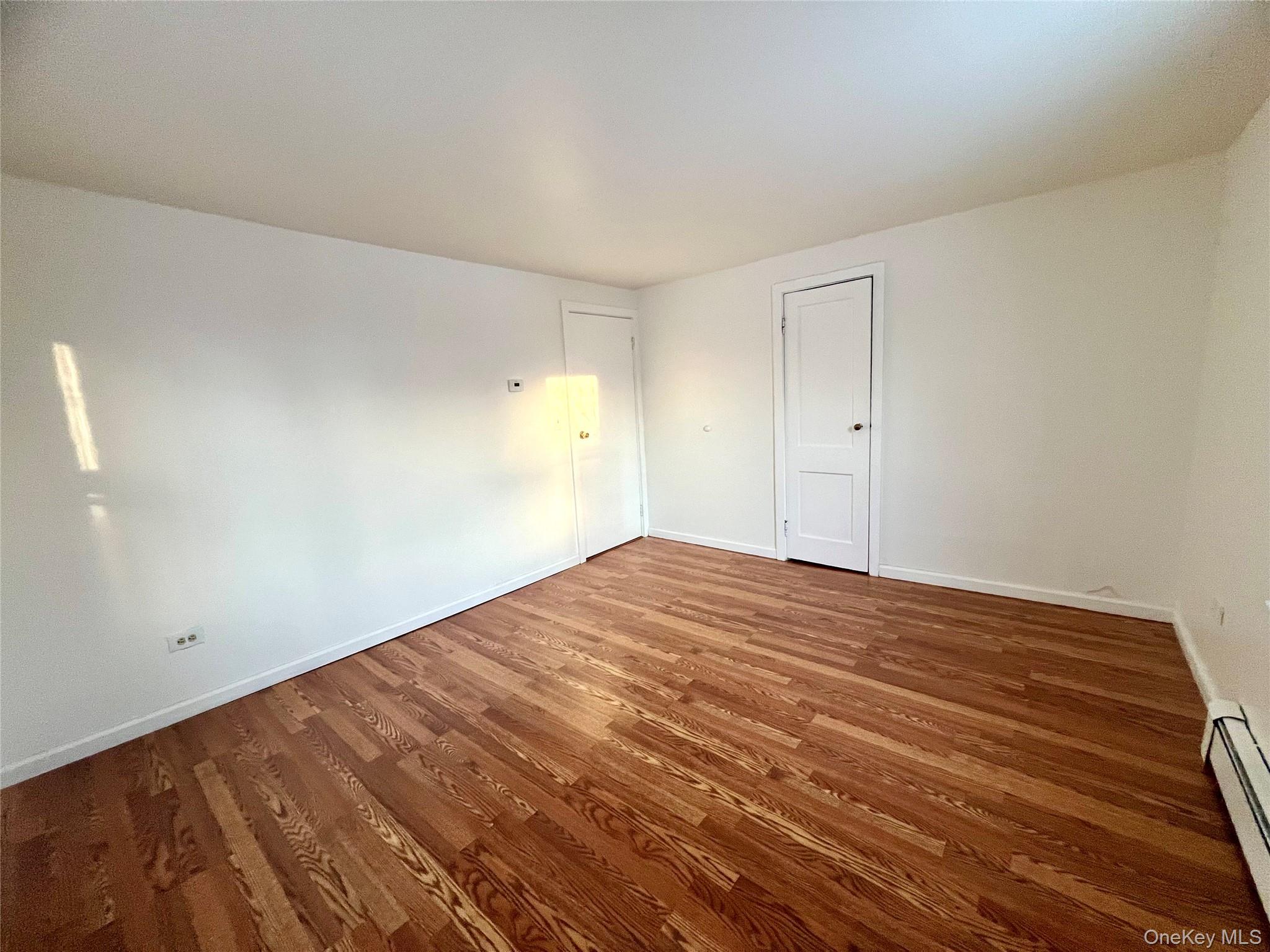 23 Independence Avenue Middletown, NY 10940 - Photo 19 of 35 a view of empty room with wooden floor