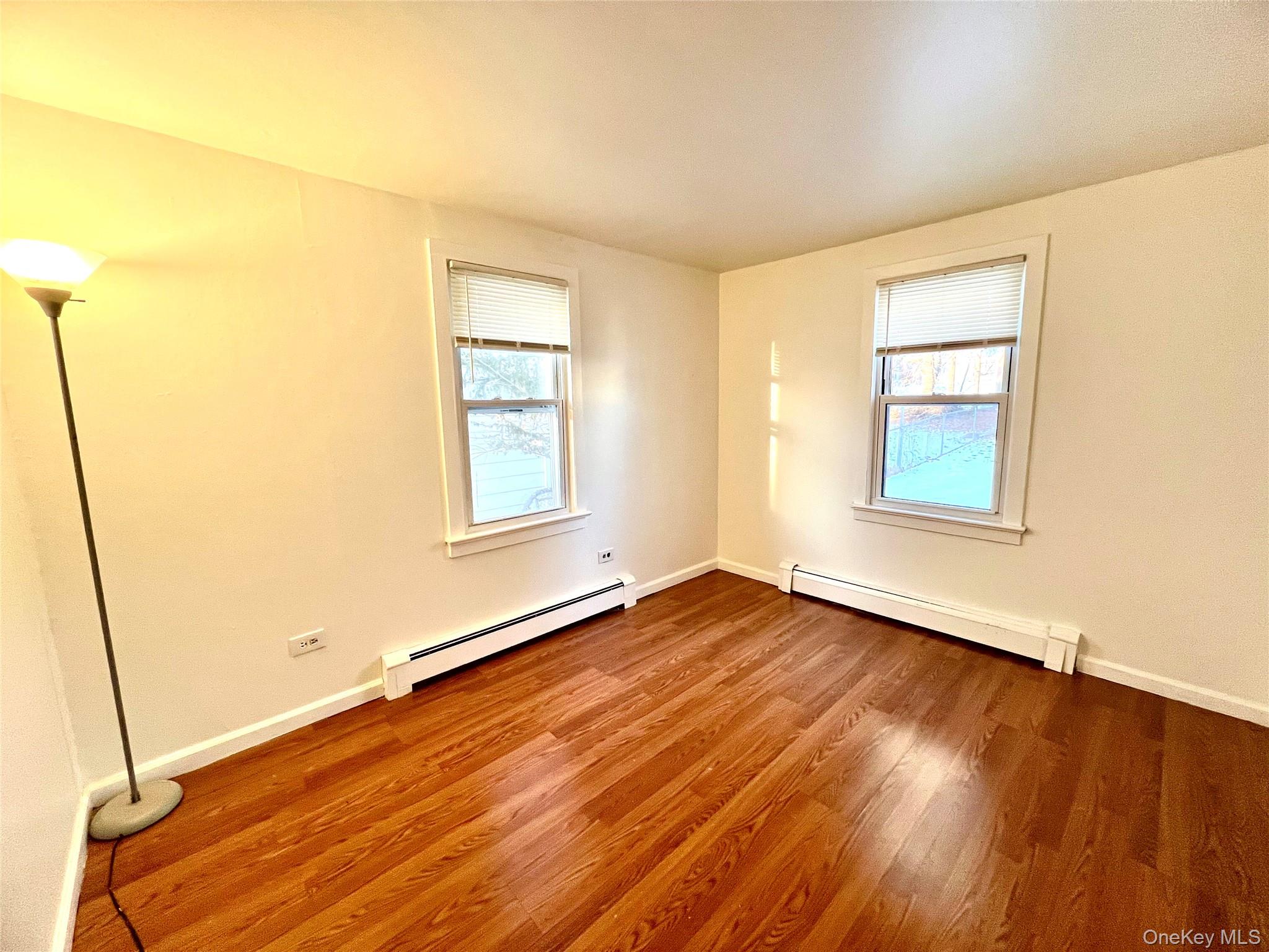 23 Independence Avenue Middletown, NY 10940 - Photo 20 of 35 a view of an empty room with window and wooden floor