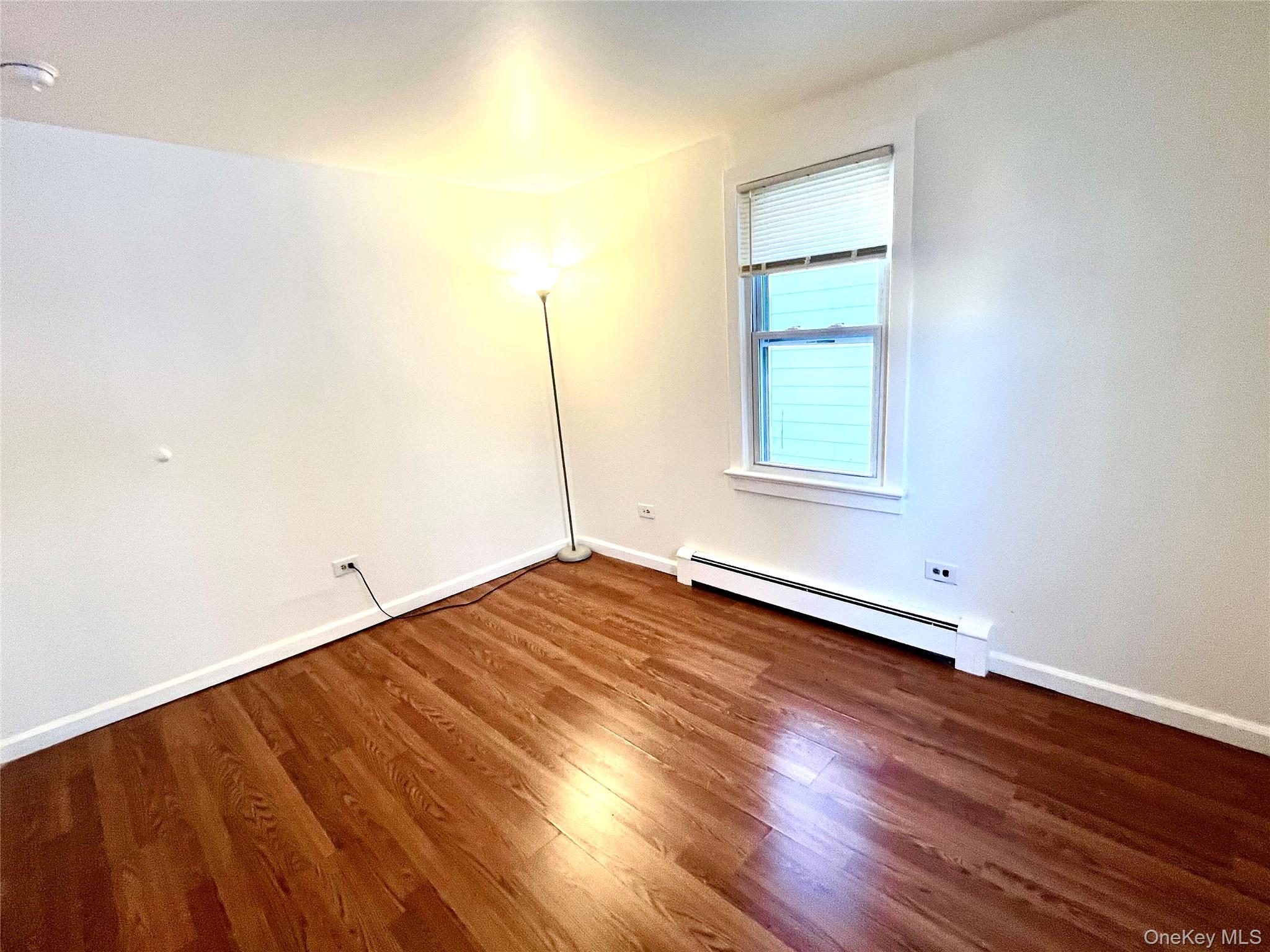 23 Independence Avenue Middletown, NY 10940 - Photo 21 of 35 an empty room with wooden floor and windows