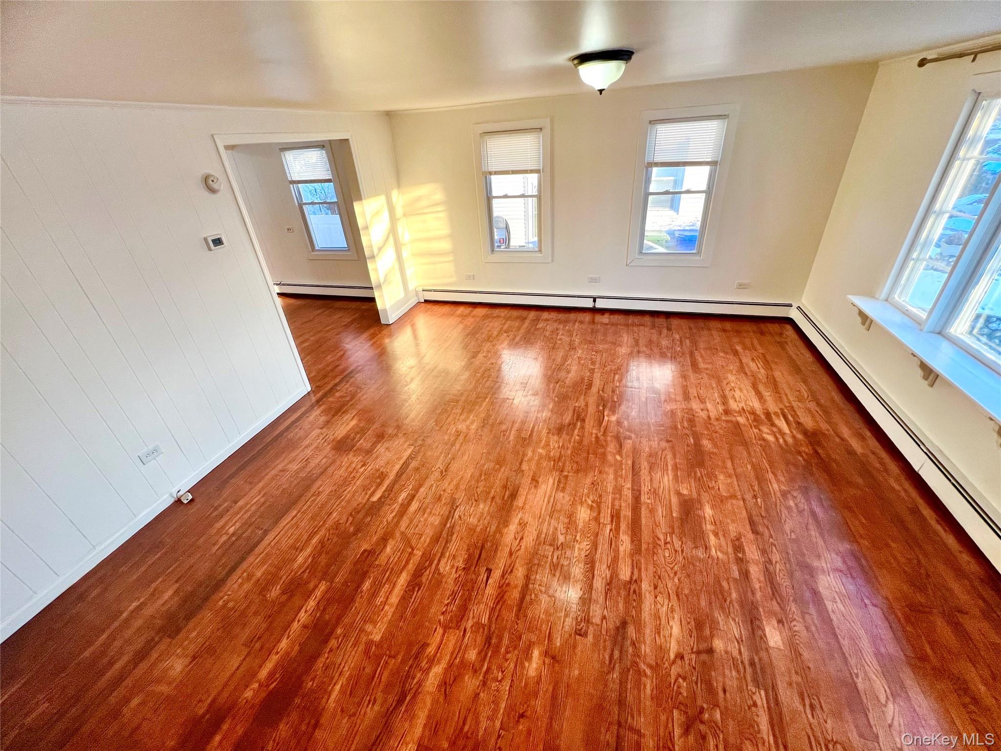 23 Independence Avenue Middletown, NY 10940 - Photo 23 of 35 a view of an empty room with wooden floor and a window