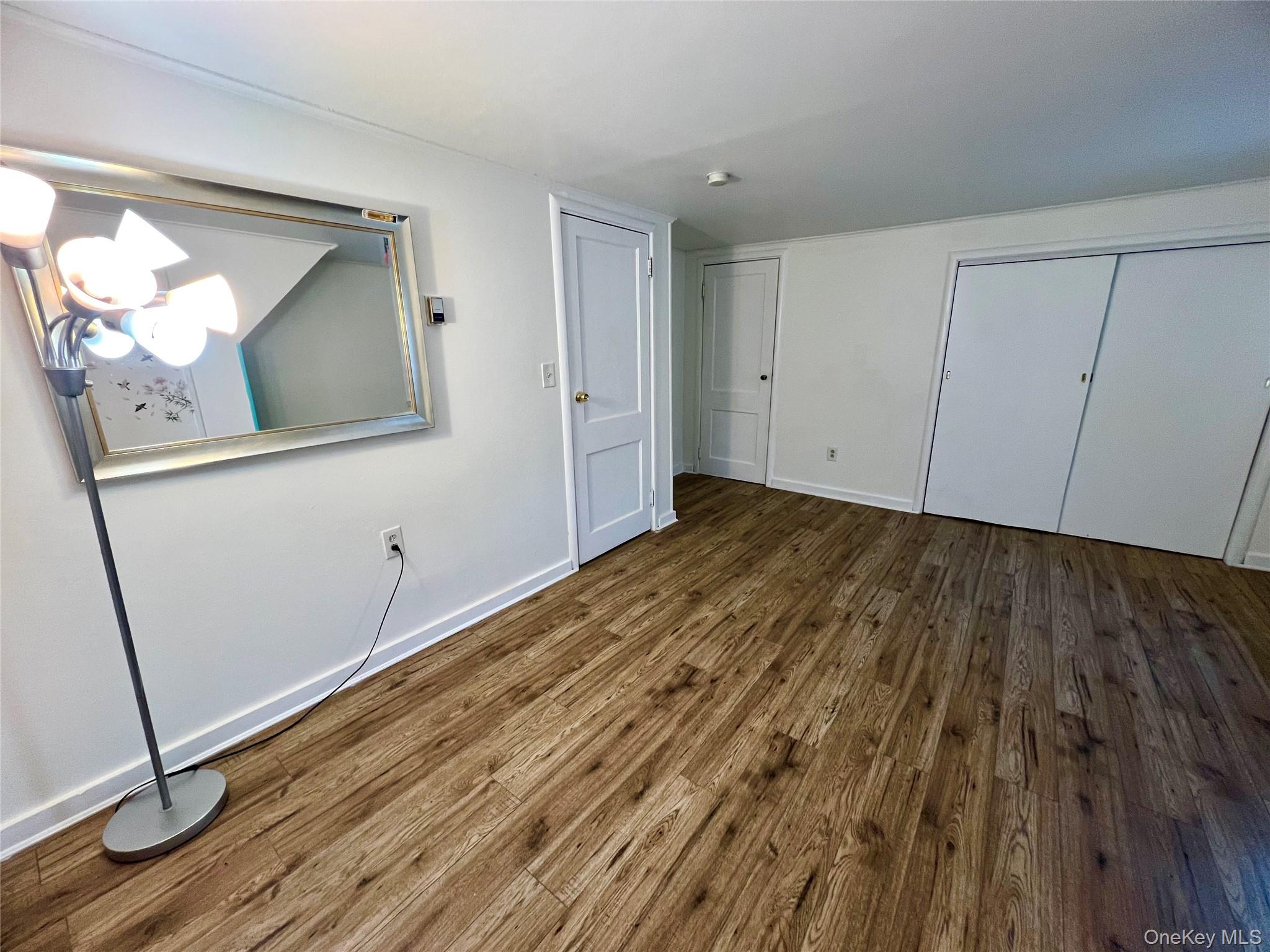 23 Independence Avenue Middletown, NY 10940 - Photo 25 of 35 a view of an empty room with wooden floor and a window