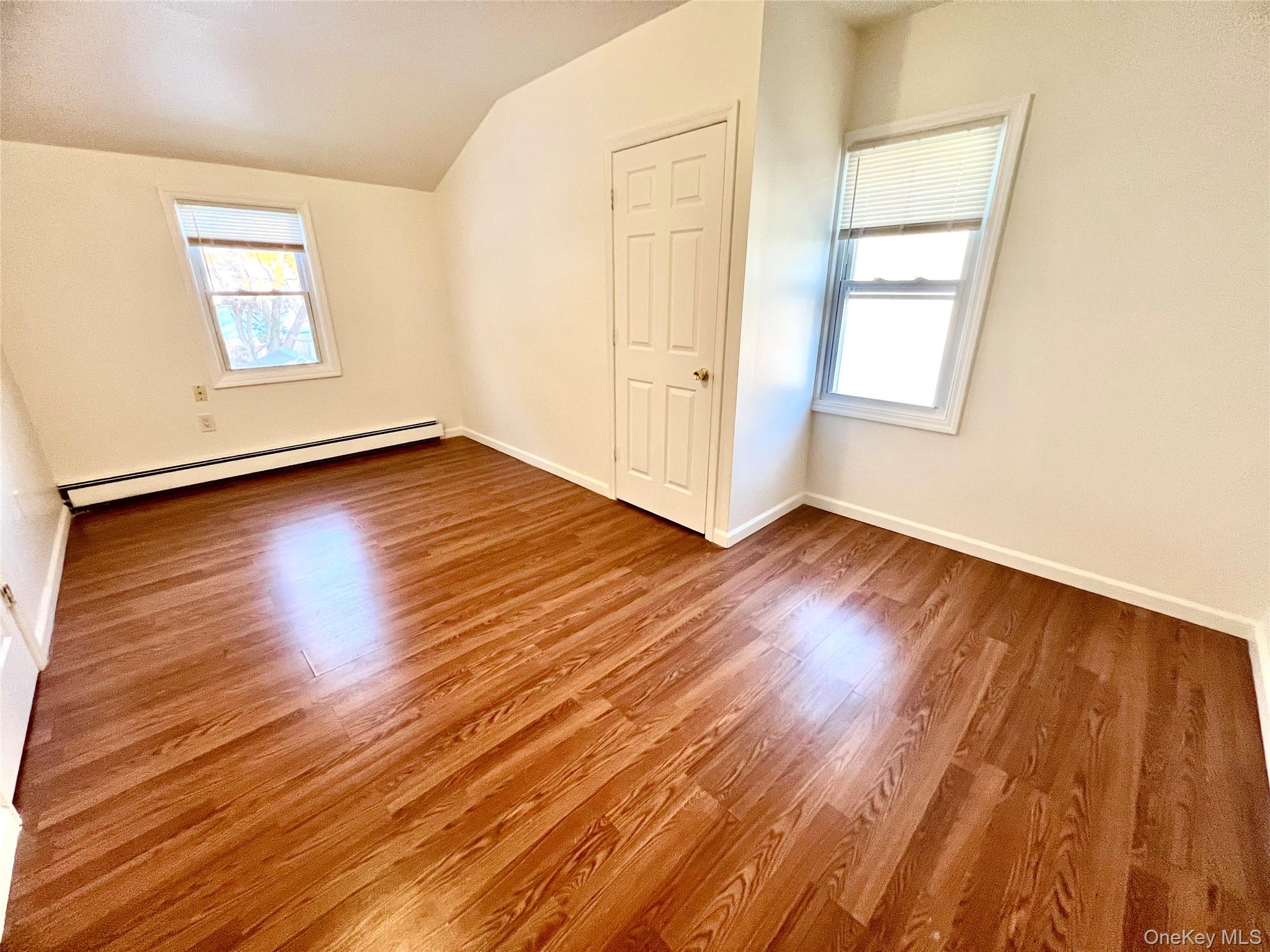 23 Independence Avenue Middletown, NY 10940 - Photo 29 of 35 an empty room with wooden floor and windows