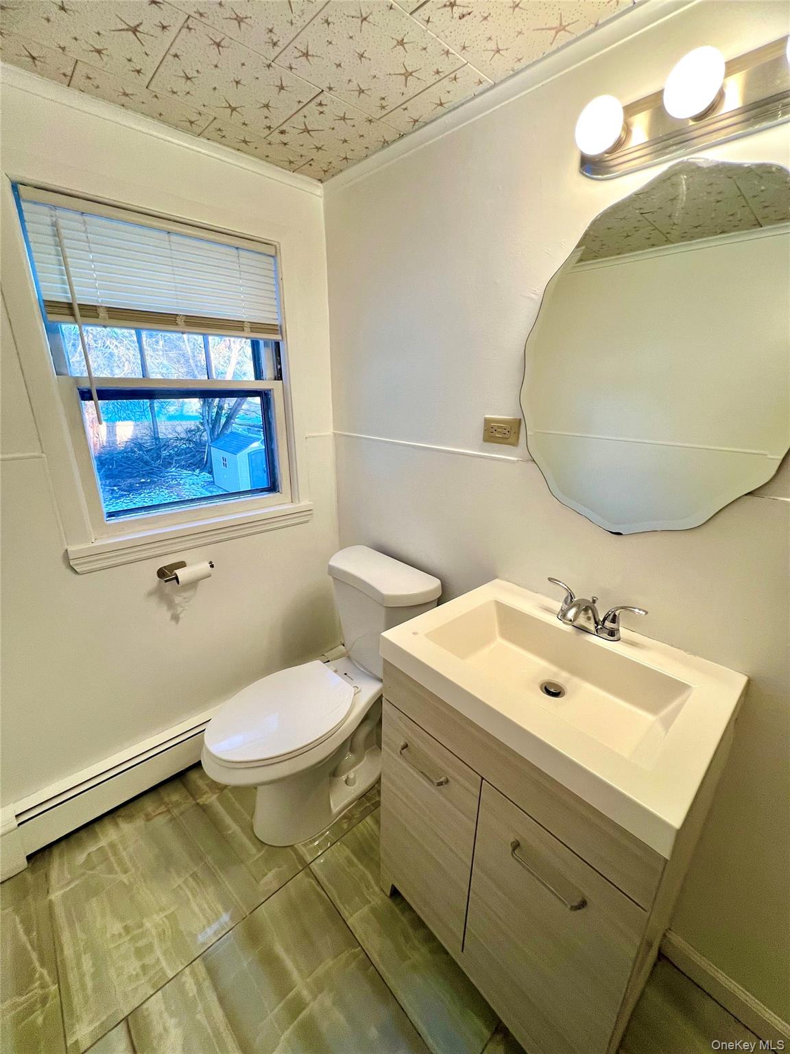 23 Independence Avenue Middletown, NY 10940 - Photo 30 of 35 a bathroom with a sink mirror and toilet