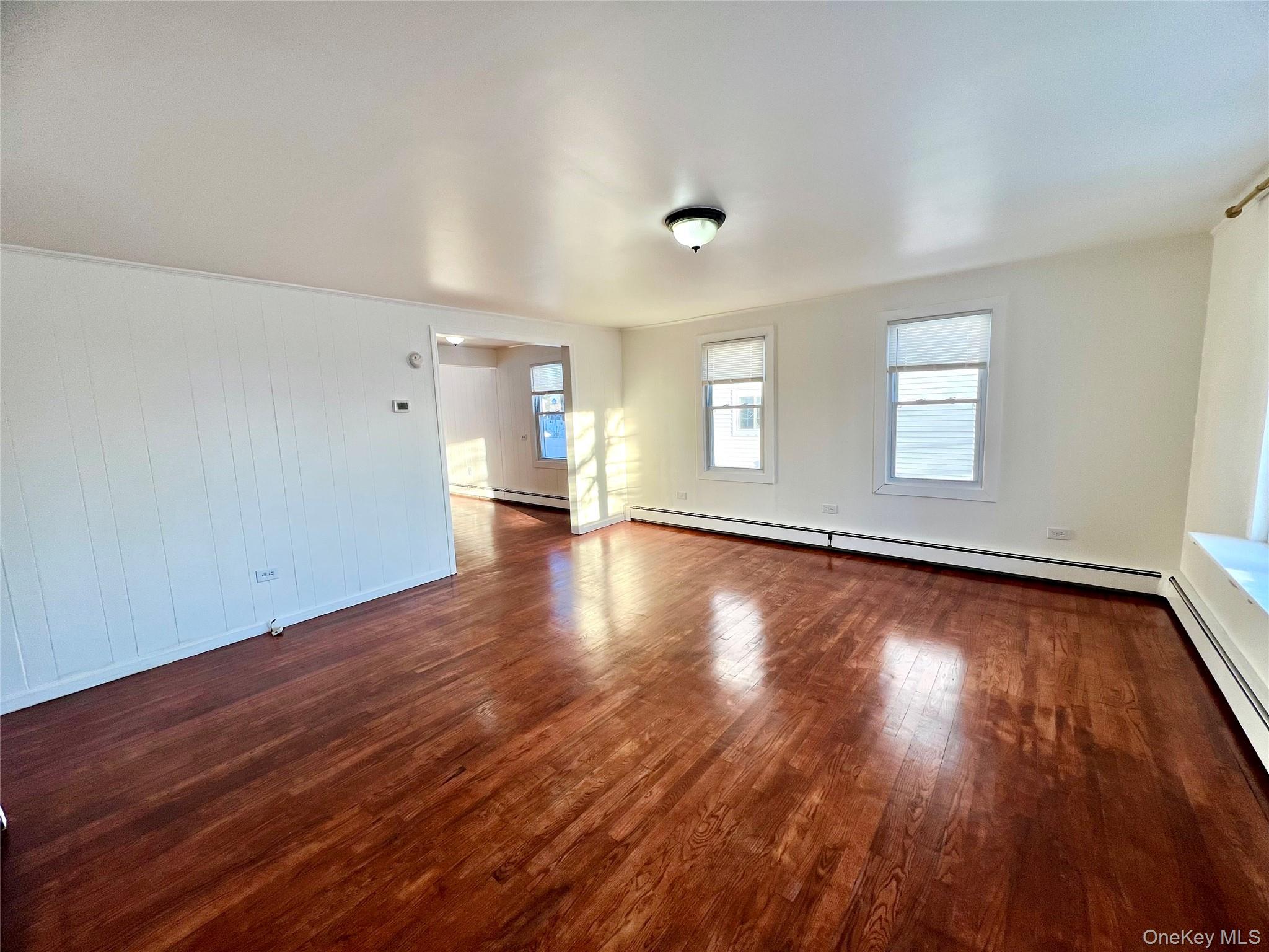 23 Independence Avenue Middletown, NY 10940 - Photo 3 of 35 an empty room with wooden floor and windows