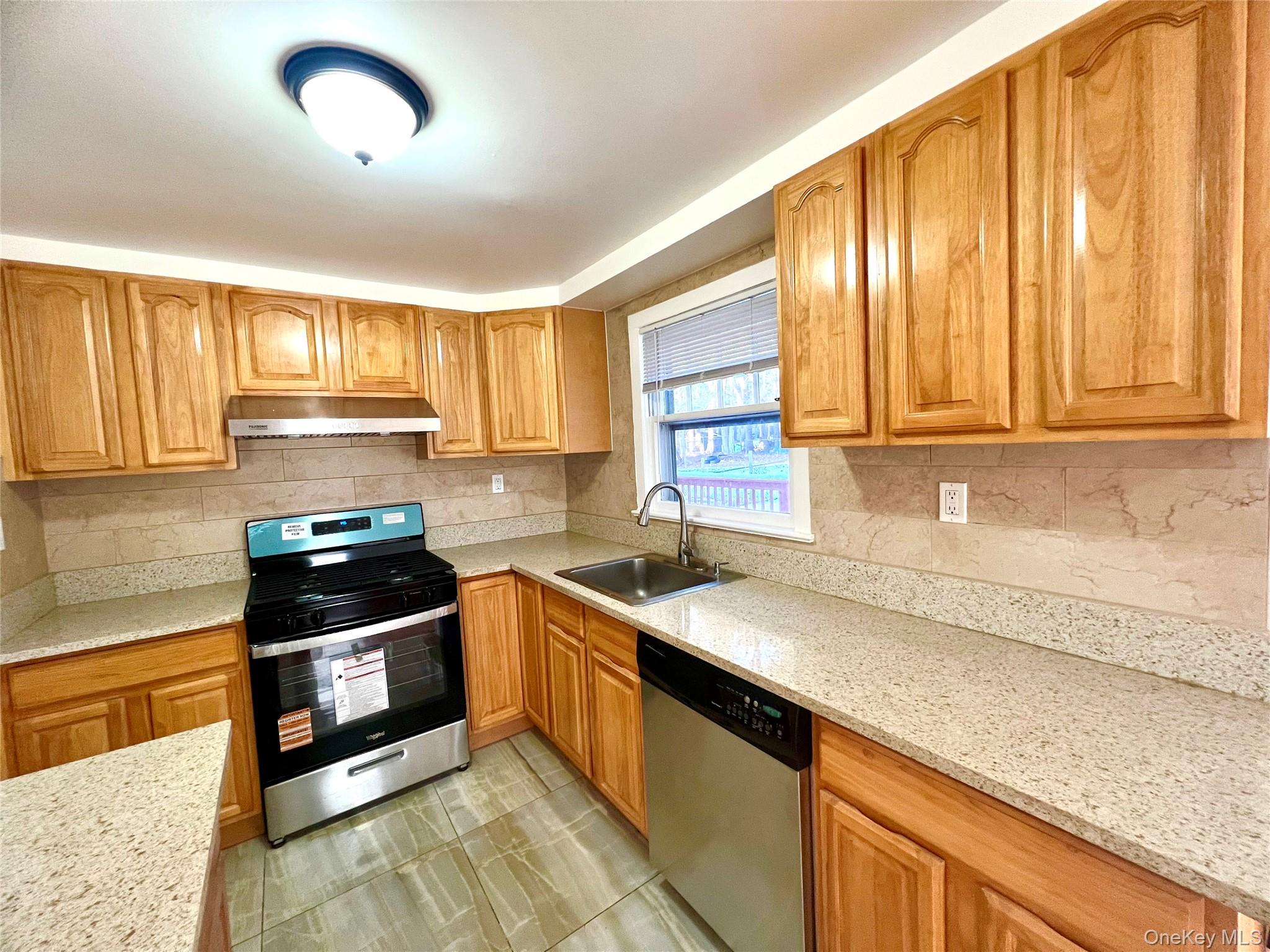 23 Independence Avenue Middletown, NY 10940 - Photo 7 of 35 a kitchen with stainless steel appliances granite countertop a sink stove and cabinets