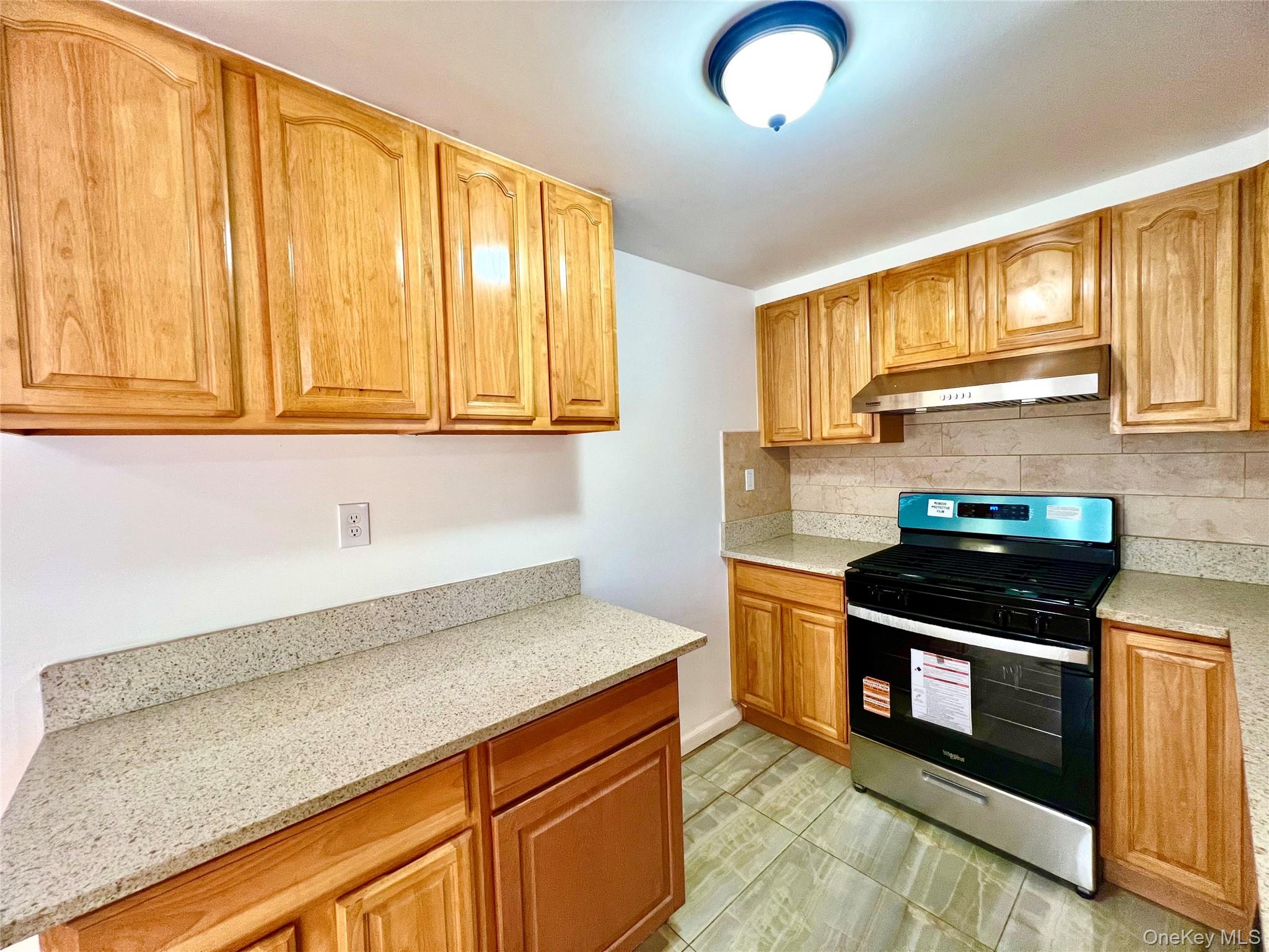 23 Independence Avenue Middletown, NY 10940 - Photo 8 of 35 a kitchen with granite countertop cabinets stainless steel appliances and a window
