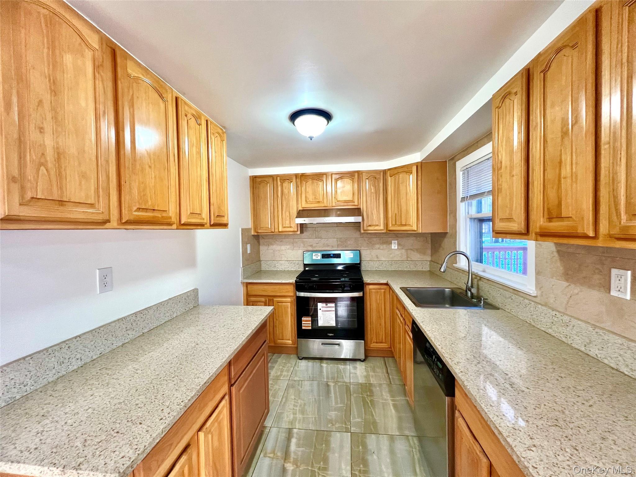23 Independence Avenue Middletown, NY 10940 - Photo 9 of 35 a kitchen with stainless steel appliances granite countertop wooden cabinets a stove and a sink