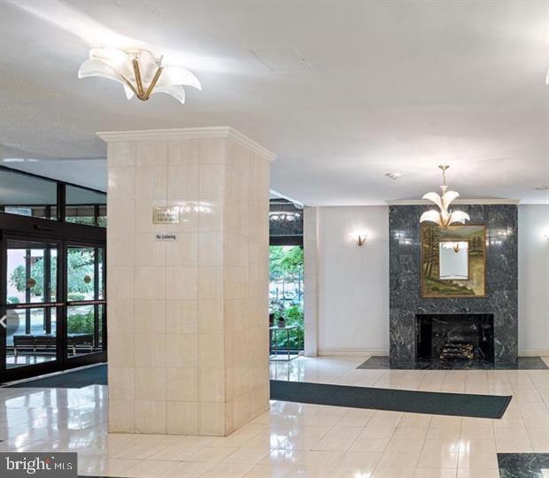 1121 Arlington Boulevard, Unit 947 Arlington, VA 22209 - Photo 2 of 11 a view of a livingroom with a fireplace and a potted plant