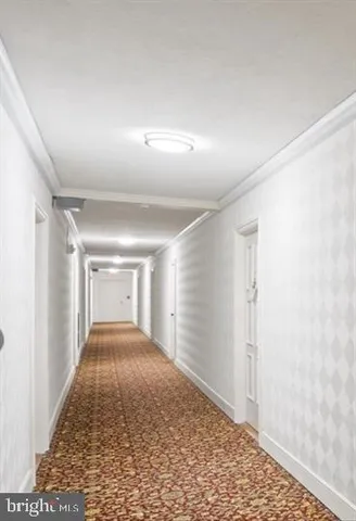 a view of a hallway with a livingroom