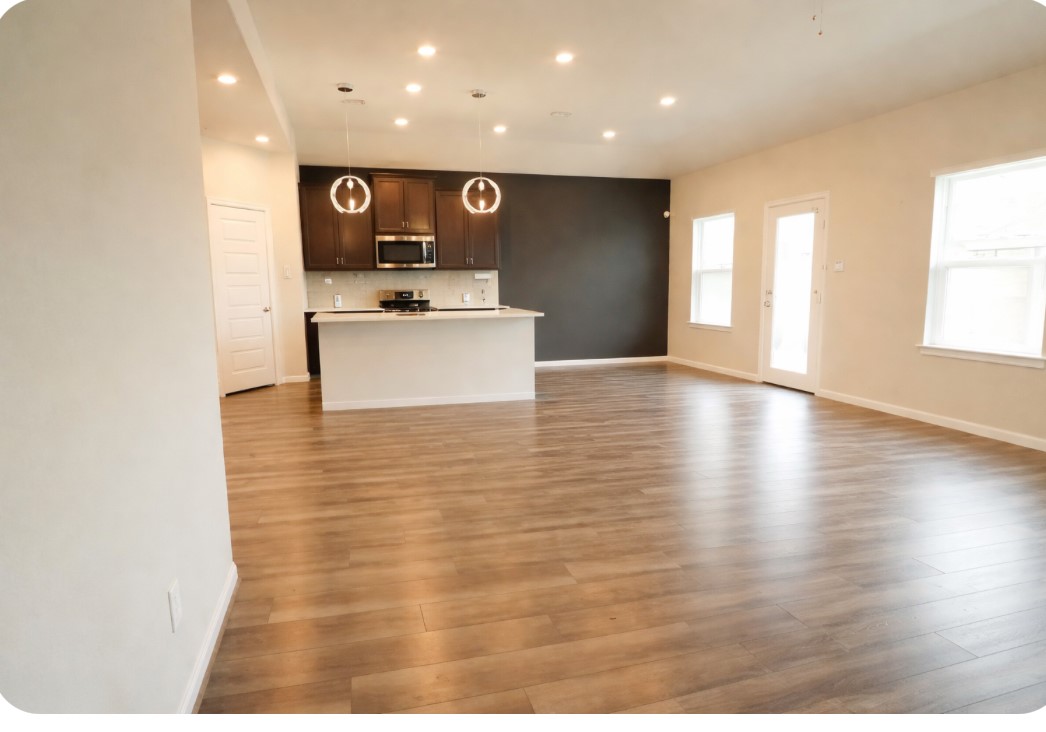 10831 Sugar Pne Lane Rosharon, TX 77583 - Photo 12 of 23 a view of kitchen with stainless steel appliances granite countertop a stove a sink and a microwave