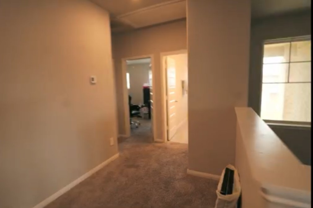 10831 Sugar Pne Lane Rosharon, TX 77583 - Photo 13 of 23 a view of a hallway with wooden floor and a bathroom