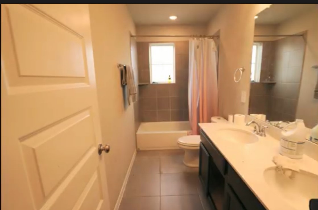 10831 Sugar Pne Lane Rosharon, TX 77583 - Photo 19 of 23 a bathroom with a tub sink and toilet