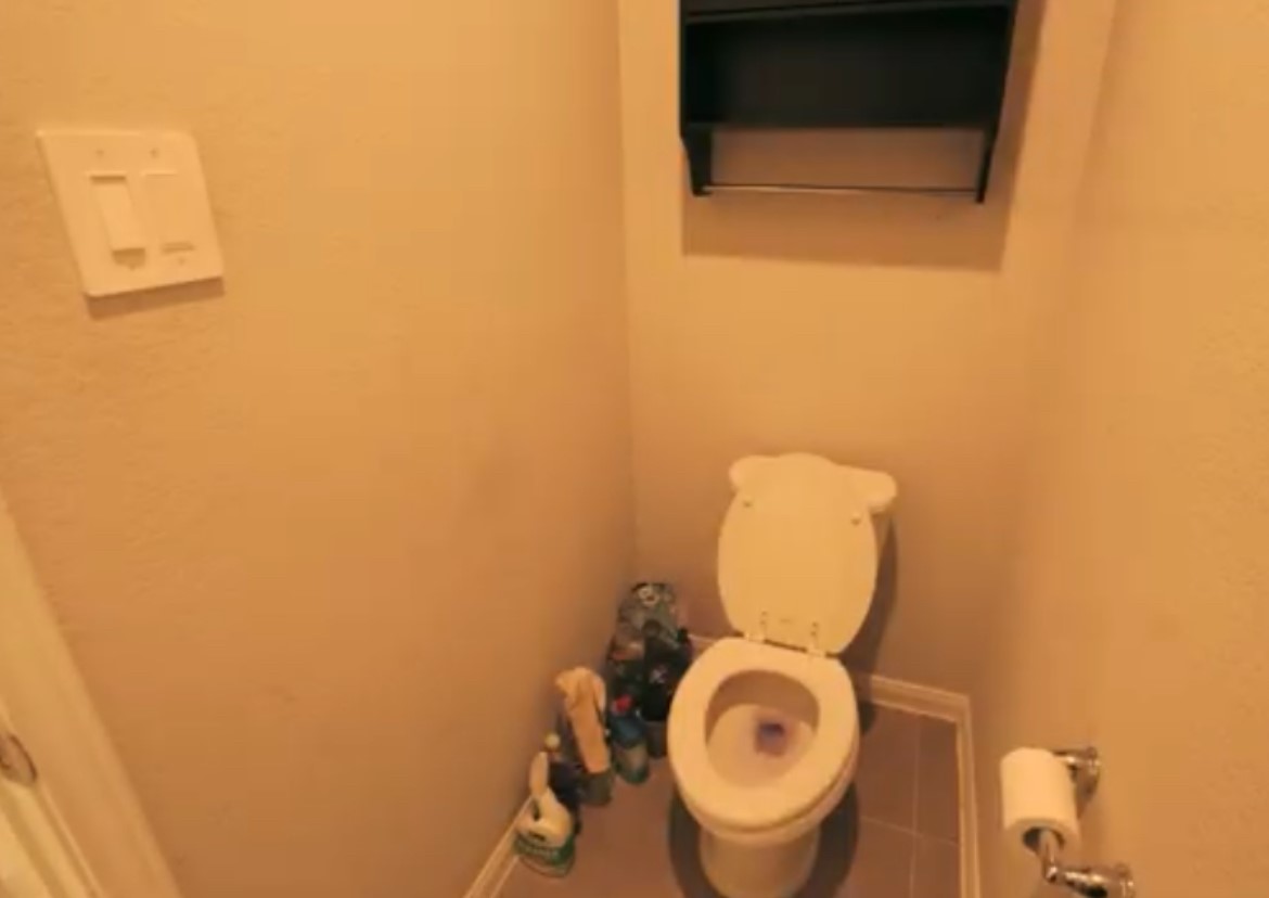 10831 Sugar Pne Lane Rosharon, TX 77583 - Photo 23 of 23 a bathroom with a toilet and a mirror