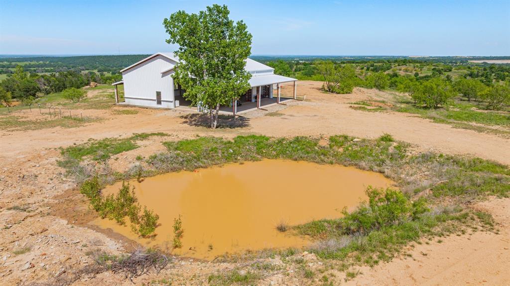 467 Weatherby Way Santo, TX 76472 - Photo 15 of 28 a view of a lake with a house in the background