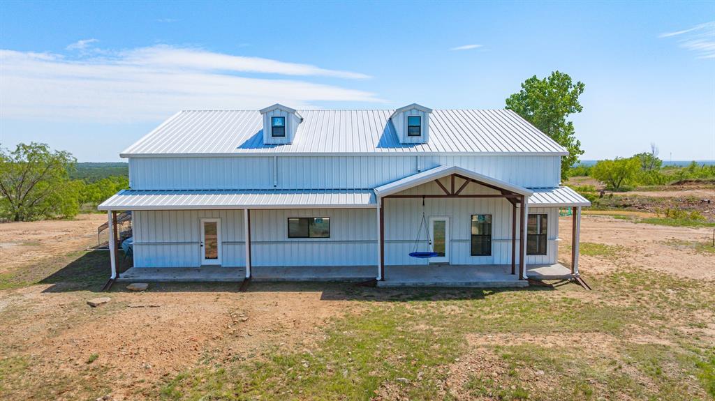 467 Weatherby Way Santo, TX 76472 - Photo 3 of 28 a front view of a house with a yard
