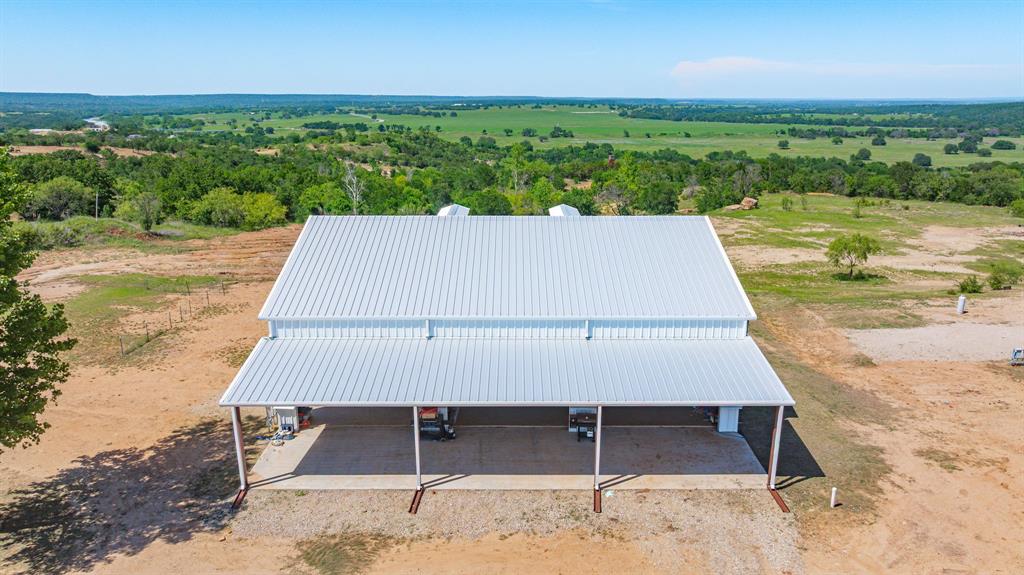 467 Weatherby Way Santo, TX 76472 - Photo 6 of 28 a view of a big yard with an ocean view