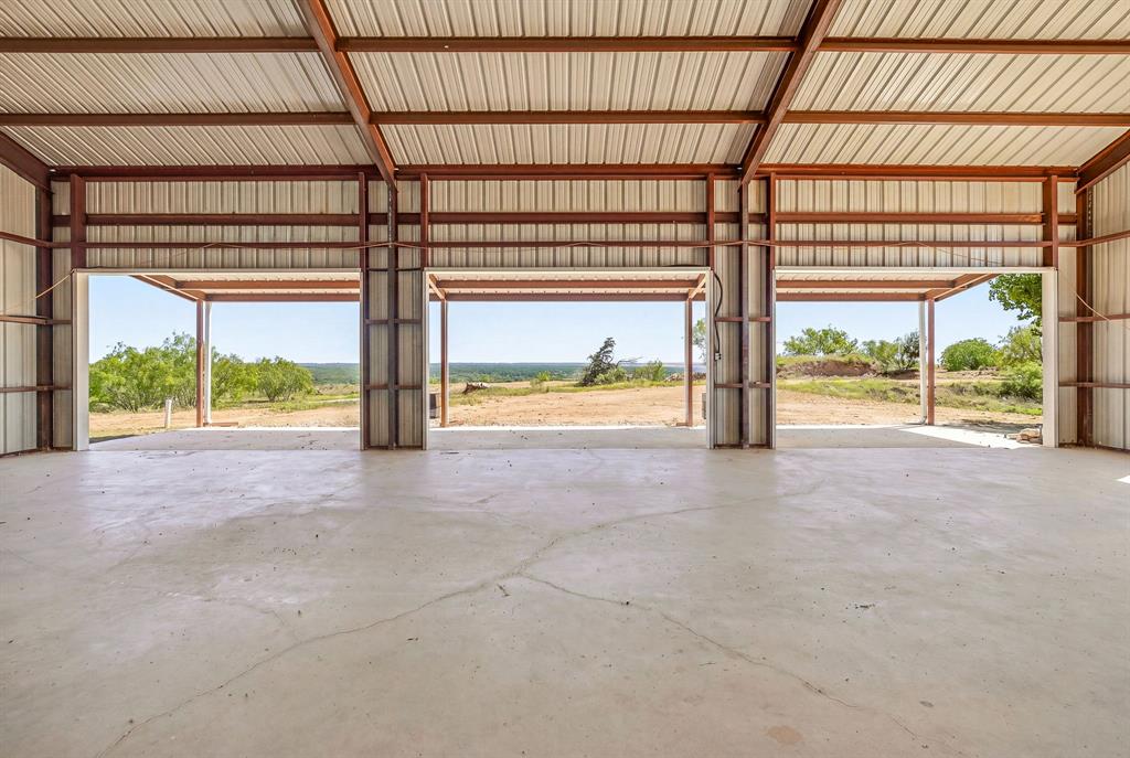 467 Weatherby Way Santo, TX 76472 - Photo 8 of 28 a view of an empty room with a floor to ceiling window and a big room
