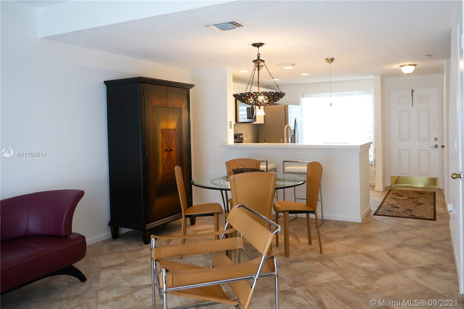 1010 Jeffery Street, Unit 1010 Boca Raton, FL 33487 - Photo 4 of 9 a living room with furniture