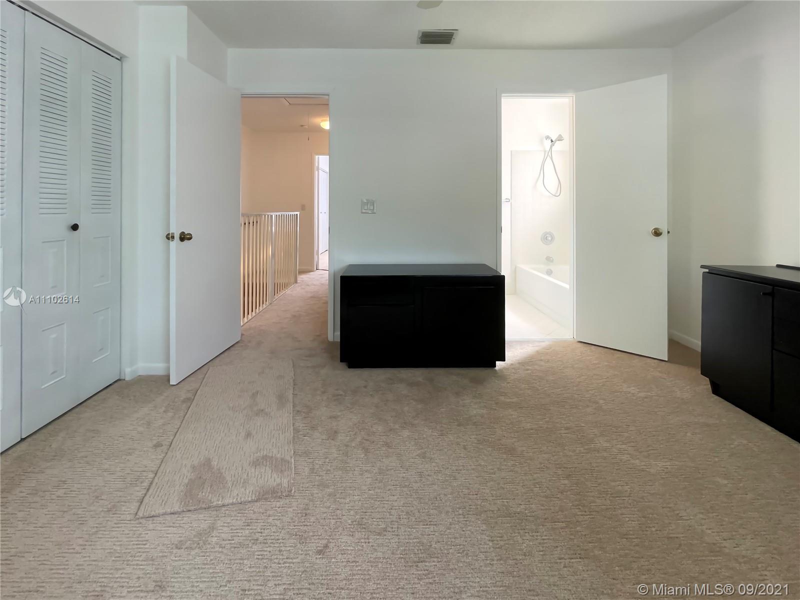 1010 Jeffery Street, Unit 1010 Boca Raton, FL 33487 - Photo 8 of 9 a view of an empty room with a kitchen
