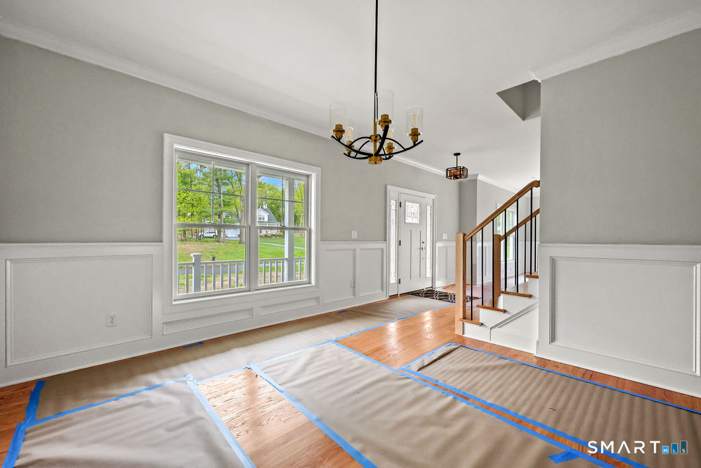 8 Ridgewood Club Road Prospect, CT 06712 - Photo 20 of 40 a view of empty room with wooden floor and fan