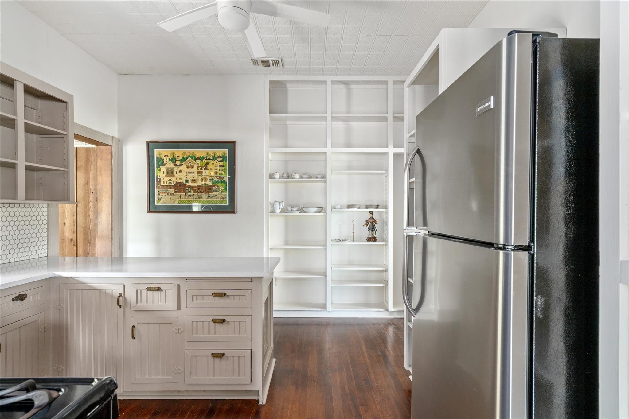 806 East Main Street Bellville, TX 77418 - Photo 12 of 38 a kitchen with stainless steel appliances a refrigerator and a stove top oven