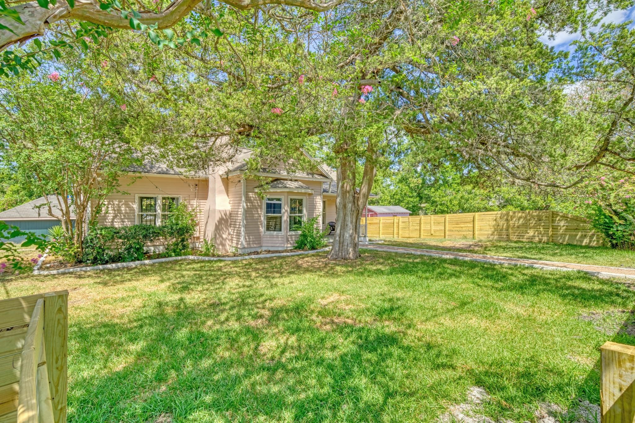 806 East Main Street Bellville, TX 77418 - Photo 38 of 38 a front view of a house with a garden