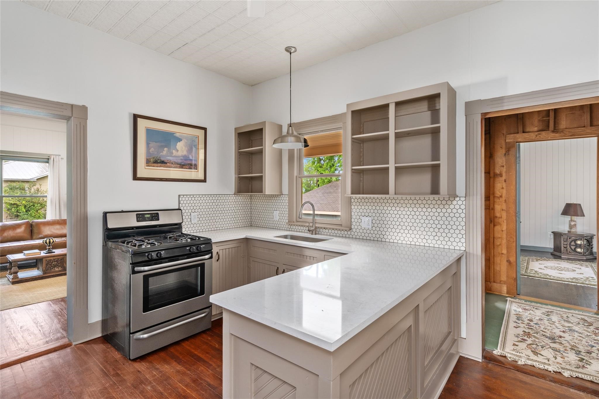 806 East Main Street Bellville, TX 77418 - Photo 10 of 38 a kitchen with granite countertop a stove and a sink