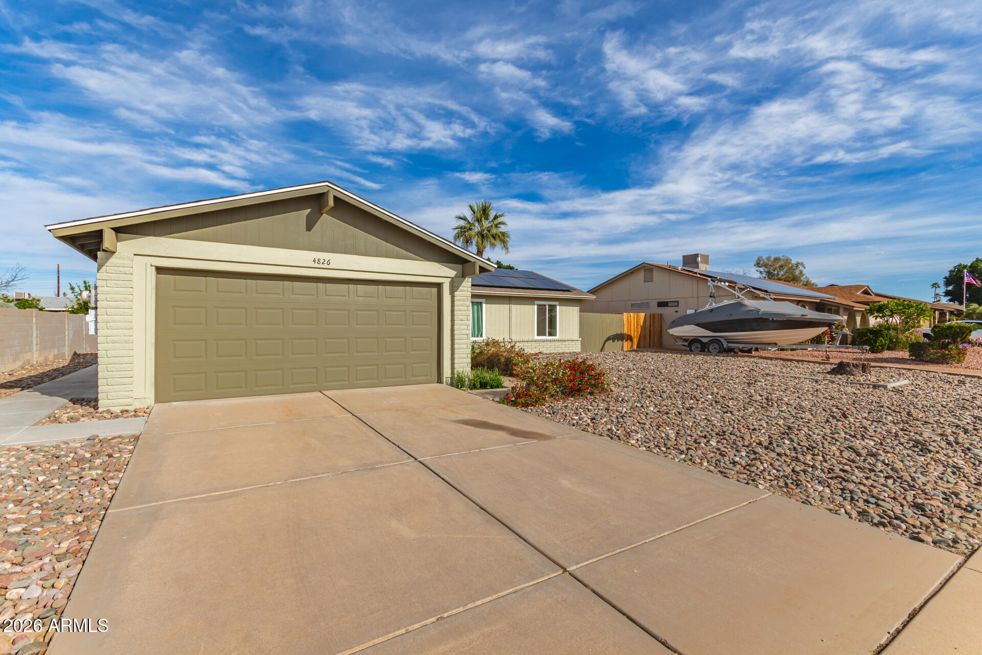 4826 West Wagoner Road Glendale, AZ 85308 - Photo 2 of 26 a front view of a house with a yard