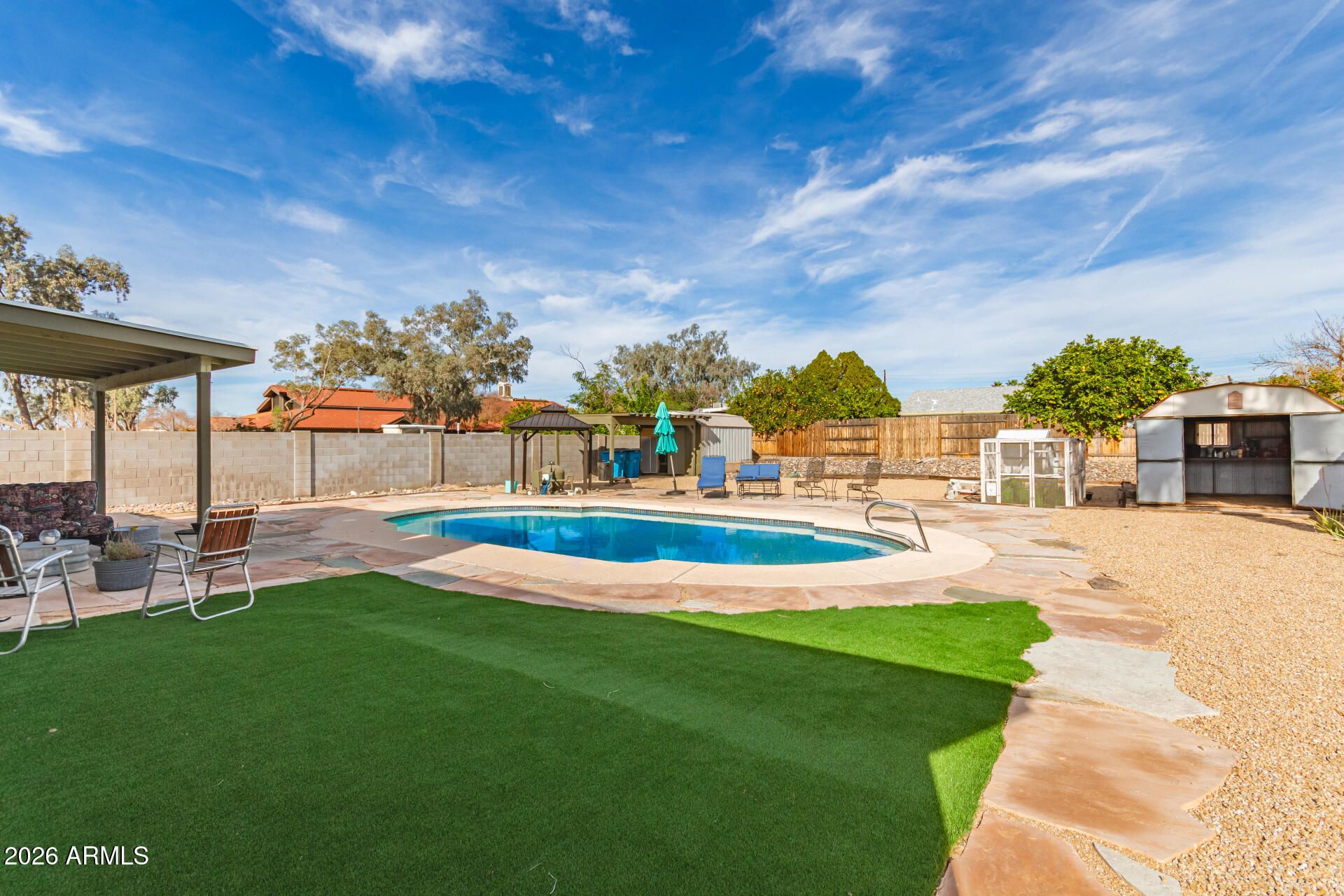 4826 West Wagoner Road Glendale, AZ 85308 - Photo 24 of 26 a view of yard with swimming pool and furniture